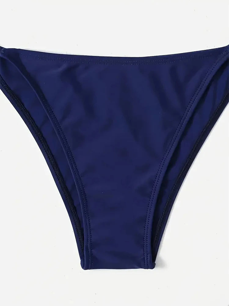 Navy blue bikini set on beach