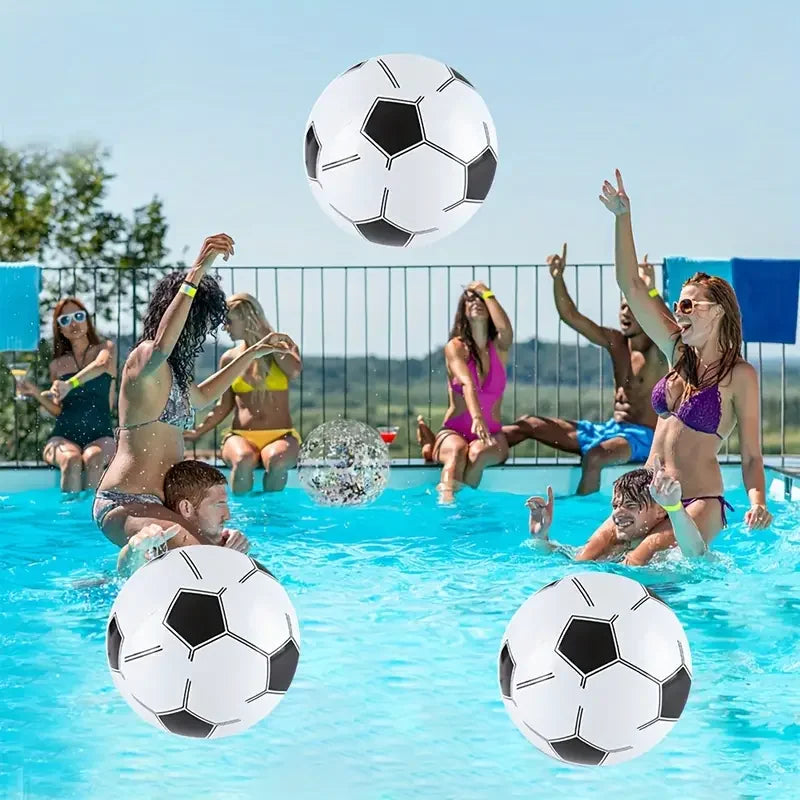 Inflatable football (soccer) style beach balls floating in pool