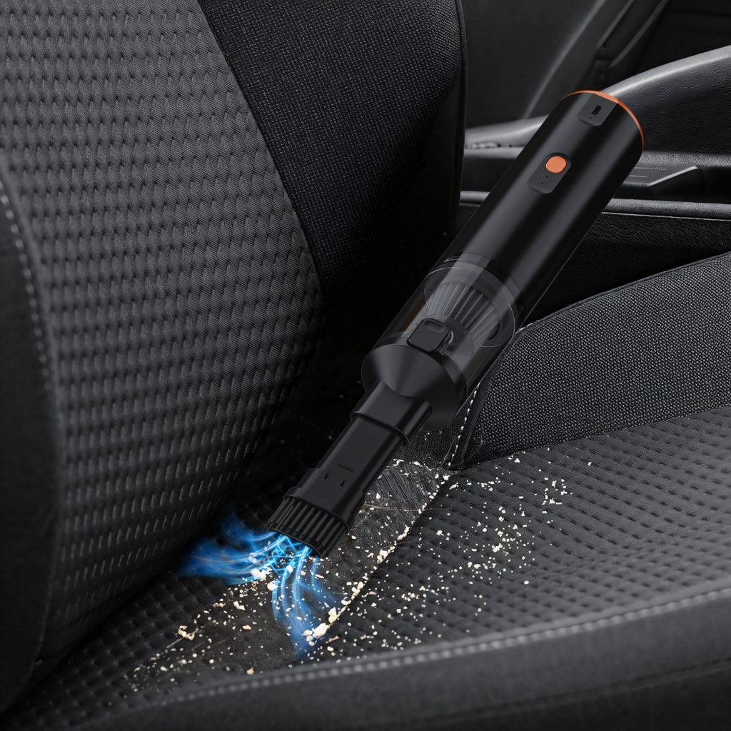VC28 handheld vacuum cleaning crumbs from a fabric sofa